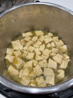 the food is being cooked in the pot on the stove top and ready to be cooked