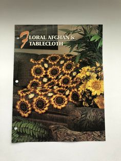 an advertisement for floral afghans and tablecloth with sunflowers in the center