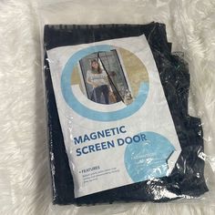 a package of magnetic screen door sitting on top of a white blanket