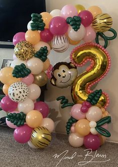 the balloon number 2 is decorated with animals and balloons