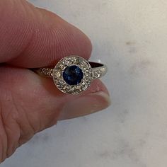 Ladies 14 K White Gold Sapphire Ring With One Medium Blue Color, Gia Type 11 Clarity, Vs2 Round Faceted Cut Sapphire. The Sapphire Weights .32 Carat, Measure 4.1 Mm Wide By 4.1 Mm Long And Is Bezel Set In 14 K White Gold. In Approximate Weight Of .10 Carat. Appraisal Is $950 Size 8 Dazzling Round Sapphire Ring With Vvs Clarity, Dazzling Sapphire Ring With Vvs Clarity, Classic Blue Diamond Ring, Luxury Cluster Ring With Sapphire In Round Cut, Blue Sapphire Gemstone Ring In Platinum, Luxury Sapphire Cluster Ring With Round Cut, Platinum Blue Sapphire Gemstone Ring, Cluster Sapphire Diamond Ring In White Gold, Blue Sapphire Heirloom Ring With Halo Design