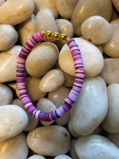 This stunning "Perfectly Purple" bracelet has a fun and unique look that will complete any outfit.  The craftsmanship of this jewelry piece is immaculate & is easy to pair with any of our fun Heishi bracelets! SHIPPING/TRACKING Free shipping on all orders throughout Canada via Canada Post WITHOUT a tracking number.  For an additional $15 CAD we can send it with a tracking number.  Please send us a private message if you would like to utilize this option. Purple Heishi Bracelet Ideas, Heishi Bracelet Ideas, Flat Bead Bracelet, Bracelets Heishi, Heishi Bracelets, Heishi Bracelet, Resin Bracelet, Purple Bracelet, Clay Bracelet