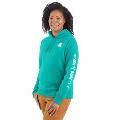 Cold winter mornings are a lot more comfortable with this women's cozy hoodie. Made of heavyweight fleece, the sweatshirt is brushed on the inside for extra softness. It has a relaxed fit that allows for easy layering, and it's finished with a Carhartt logo down the sleeve. Features10.5-ounce, 73% cotton / 27% polyesterThree-piece hood with drawcordRib-knit cuffs and waist help keep out the coldFront pouch pocketCarhartt signature logo printed on sleeve; Carhartt 'C' graphic on frontModel in Bla Womens Work Shirt, Country Jeans, Mens Work Shirts, Carhartt Logo, Carhartt Hoodie, Mens Work Pants, Carhartt Womens, Safety Clothing, Carhartt Women