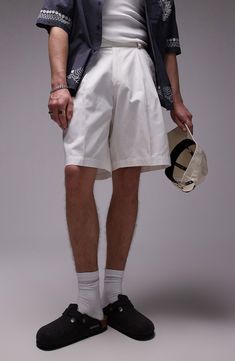 Made from pure cotton and styled with crisp pleats, these shorts are ideal for casual warm-weather days. Zip fly with hook-and-bar tab closure Side-seam pockets; back welt pockets 100% cotton Machine wash, line dry Imported Summer Cotton Bermuda Shorts With Belt Loops, Cotton Shorts With Pockets For Spring, Classic Spring Shorts With Side Pockets, Classic Cotton Bermuda Shorts For Summer, Relaxed Fit Cotton Shorts With Belt Loops, Classic High-waisted Bermuda Shorts With Relaxed Fit, White Bermuda Shorts With Pockets For Summer, Classic High-waisted Bermuda Shorts, Summer Cotton Bottoms With Welt Pockets