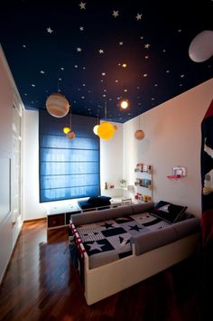 a bedroom with stars painted on the ceiling