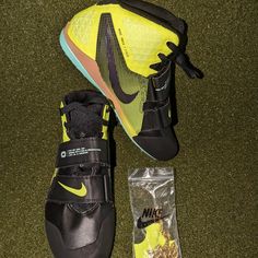 a pair of nike shoes next to a bag of cereal and a shoelace on the ground