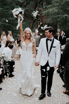 a newly married couple walking down the aisle