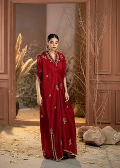 Wrap yourself in style with our Red Rawsilk Kaftan. It's a perfect blend of classic and modern, making you look effortlessly elegant. Elevate your fashion game with ease.