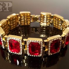 Hip Hop Celebrity Rick Ross Red Ruby Cz Bracelet 14k Gold Plating For A Premium Quality Finish That Will Turn Heads. 18mm Width And 8.5" Length. Luxury Clasp To Lock Your Bracelet Easily And Securely. Celebrity Style High Quality & Polished. Top Quality Cz Stones Luxury Red Round Gold Bracelet, Luxury Red Ruby Tennis Bracelet, Luxury Red Diamond Jubilee Bracelet, Luxury Jewelry With Diamond Accents And Lab-created Ruby, Classic Red Cubic Zirconia Jewelry, Red Luxury Tennis Bracelet For Formal Occasions, Luxury Red Ruby Bracelets, Formal Red Diamond Bracelet, Luxury Red Diamond Bracelet For Anniversary