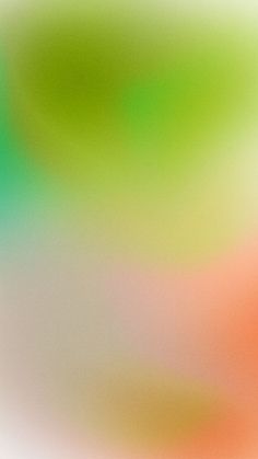 a blurry image of an orange and green object