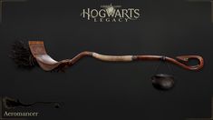 the hogwart's legact is attached to an old fashioned hook with a broom hanging from it