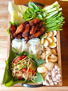 an assortment of food is displayed on a tray