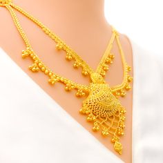 This 22k gold light patta set features a traditional festive tasseled design, perfect for adding elegance to any outfit. Weighing 55.0 grams, it showcases a yellow gold finish that enhances its intricate and celebratory appearance. The set has a length of 24 inches with a 2.5-inch drop and includes adjustable 1.5-inch links for a comfortable fit. Secured with a hook lock, it combines style and practicality. The matching earrings, each 2.2 inches long, feature screw back posts for added security. Gold Zari Weaving Jewelry For Weddings, Festive Gold Jewelry With Zari Weaving, Gold Wedding Jewelry With Zari Weaving, Yellow Gold Temple Necklace With Latkans For Celebrations, Elegant Gold Temple Necklace With Latkans, Celebration Yellow Gold Temple Necklace With Latkans, Gold Temple Necklace With Tilla For Eid, Festive Yellow Gold Temple Necklace With Latkans, Festive Yellow Gold Temple Necklace With Elegant Design