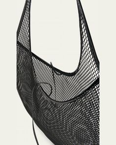 ALAIA shoulder bag in mesh nylon and leather     Flat shoulder strap    Open top with selftie closure     Unlined     Approx. 7.9"H x 15.8"W x 3.9"D    Made in Italy Black Mesh Shoulder Bag For Travel, Daily Use Mesh Shoulder Bag With Mesh Lining, Mesh Shoulder Bag For Shopping, Mesh Tote Shoulder Bag With Mesh Lining, Shopping Tote Shoulder Bag With Mesh Lining, Shopping Shoulder Bag With Mesh Lining, Travel Mesh Shoulder Bag With Mesh Lining, Evening Nylon Tote Shoulder Bag, Luxury Black Shoulder Bag For Summer