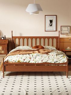 a dog laying on top of a bed next to a night stand and dressers