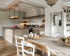 a kitchen with a table and chairs in it