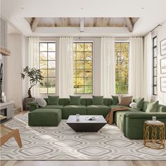 a living room filled with green couches and chairs in front of two large windows