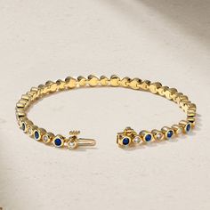 Brilliant blue sapphires and sparkling diamonds of alternating sizes are secured in bezels and fully wrap the wrist in this modern and whimsical line bracelet. Wear yours solo or layer it together with other dainty bracelets for a more personalized look. Metal: 18kt Gold Sapphire Weight: 1.80 ct. Diamond Weight: 0.66 ct. Measurements: 6.5" length *Please note that the listed ct. weights are approximate and may be subject to slight variations. Dainty Jewelry Gold, Minimal Jewellery, Dainty Gold Jewelry, Fancy Jewellery Designs, Hand Accessories, Diamond Tennis Bracelet, Nose Jewelry, Fancy Jewellery, Sapphire Bracelet