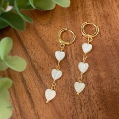 🤎 Item details 🤎 Size: Hoop 12x2mm    Total length 5cm Material: White Mother of Pearl High quality 18k gold plated hoop earrings White 14k Gold Filled Hoop Earrings, White Dainty Gold-plated Hoop Earrings, White Gold Plated Dainty Hoop Earrings, White Heart Beads Drop Earrings, White Dangle Heart Earrings With Ear Wire, White Drop Earrings With Heart Beads, White Pierced Earrings For Valentine's Day, Trendy White Double Heart Jewelry, White Valentine's Day Earrings