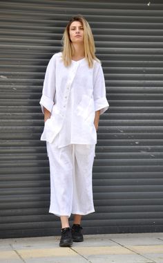 "New summer collection . 100% LINEN - Shirt and pants. Plus size SET. Extravagant loose asymmetric white shirt,or tunic , so elegant and comfortable. Perfect solution for your everyday outfit. Extravagant set. Shirt with asymmetric fastening. Trousers with an asymmetrical tie on one side and an internal tie. Model on picture is wearing size S. Material: 100% Linen Custom Orders We could customize the garments. We can adjust the length of the skirt and pants, or the sleeve of any garment for a sm White Linen Shirt Outfit, Women Linen Clothing, White Linen Outfit, Linen Suits Women, Linen Shirt Outfit, Plus Size Set, Tunic And Pants, White Outfits For Women, White Linen Suit