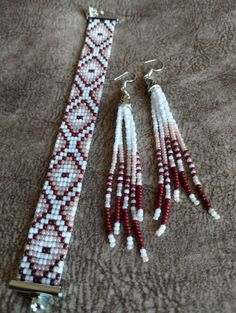 two beaded bracelets are laying on the floor next to each other, one is red and white