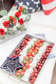 an american flag tray with berries, strawberries and blueberries