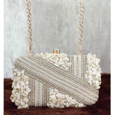 This stunning  Party Clutch Bag is embellished with pearls and shells on a white silk Base . This Minaudière Clutch is ideal for parties and weddings and any festive occasion. This  Handmade Embroidered Embellished Sling Purse can be used with or without the metal sling that is included. Dazzle through the Day or Evening with this beautifully Handcrafted  Wedding Bridal Clutch Bag. Perfect for a Bride, Bridal Gift, Bridal Clutch, Wedding Clutch, Mehndi, Nikaah, Shaadi, Sangeet, Indian and Pakist Bridal Clutch Purse, Sling Purse, Bridal Clutch Bag, Lady Dior Handbag, Expensive Bag, Wedding Handbag, Luxury Bags Collection, Target Gift Cards, Bridal Bag