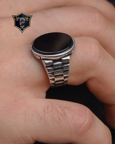 "Watch Strap Design Silver Ring, Black Onyx Gemstone, Handmade Ring, 925 Sterling Silver, Turkish Silver Ring, Fashion Ring, Best Gift ✦ Details ✦ * Material: 925 Sterling Silver * Gemstone: Onyx  * Weight: 11.00 grams * The size of the stone: 15*20 mm. * Stamp: 925 * Available sizes; 5 US to 16 US. Contact me if you need any other size! ✦ Shipping ✦ * Processing time: 1-3 business days. * This item ships from my Turkish workshop in Istanbul. * Add your phone number in address box for a smoother delivery. That makes courier personnel's job easier.  ✦ Packaging ✦ * Comes with a luxury gift box and a jewellery cleaning cloth and courtesy gift. ✦ Returns, Exchanges ✦ * Return option available for 30 days after the delivery. * The product has to be in the same shape, type, and material. * Pers Black Sterling Silver Signet Ring With Polished Finish, Black Stainless Steel Open Ring Jewelry, Black Signet Ring With Polished Finish, Silver Onyx Round Ring, Black Sterling Silver Signet Ring 925 Stamped, Black Sterling Silver Signet Ring Stamped 925, Silver Onyx Signet Ring, Black Sterling Silver Signet Ring, Black Enamel Sterling Silver Signet Ring