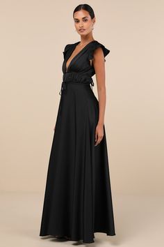 The Lulus I'm All Yours Black Satin Cutout Ruffled Maxi Dress is dedicated to making you look lovely! Sleek woven satin sweeps from ruffled, cap sleeves into a plunging V-neckline and matching V-back. A banded empire waist, with a set of tying details at the front and back, sits atop a cascading skirt that falls to an elegant maxi hem. Hidden back zipper/clasp. Fit: This garment fits true to size. Length: Floor length. Size medium measures 48.5" from shoulder to hem. Bust: Great for any cup size Fitted Satin Dress With Cap Sleeves, Satin Short Sleeve Dress With Ruffles, Short Sleeve Satin Dress With Ruffles, Fitted Satin Dress With Ruffles For Evening, Black Satin Maxi Dress With Satin Finish, Black Ruched Satin Dress, Ruffled Satin Maxi Dress For Evening, Elegant Satin Maxi Dress With Ruffles, Satin Maxi Dress With Ruffles For Cocktail Events