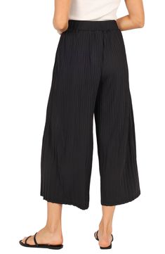 These flowy, culotte-style pants have an elastic waist and pleated design so you move with ease every day whether you're going out or enjoying a day at home. Elastic waist Unlined 100% polyester Hand wash, dry flat Imported Relaxed Fit Bottoms With Pleated Waist And Wide Leg, Relaxed Fit Wide Leg Bottoms With Pleated Waist, Wide Leg Pleated Waist Pants For Summer, Wide Leg Pants With Pleated Waist For Summer, Spring Wide Leg Trousers With Pleated Waist, Chic Bottoms With Pleated Waist And Relaxed Fit, Chic Relaxed Fit Bottoms With Pleated Waist, Summer High-waisted Pleated Waist Pants, Summer Trousers With Pleated Waist