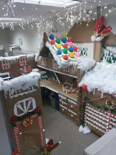 an office decorated for christmas with gingerbread houses