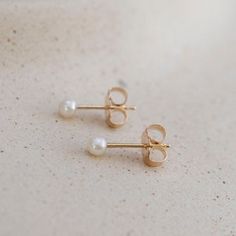 Minimalist Earrings For Everyday And Mother's Day, Tiny Elegant Pearl Earrings For Gifts, 14k Gold Dainty Pearl Earrings For Anniversary, 14k Yellow Gold Pearl Earrings For Gift, 14k Yellow Gold Pearl Earrings As Gift, Dainty 14k Gold Pearl Earrings For Anniversary, Dainty Everyday Pearl Earrings In 14k Gold, Dainty 14k Gold-filled Pearl Earrings For Everyday, Dainty 14k Gold Filled Pearl Earrings For Everyday