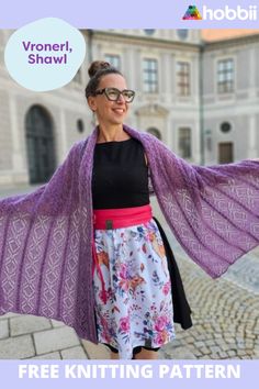 a woman wearing a purple shawl with her hands on her hips and the text free knitting pattern