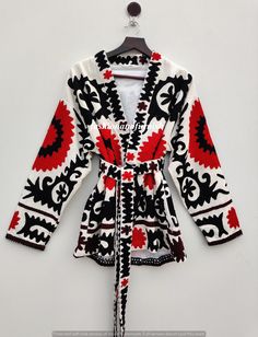 "Designer's Embroidery Work Coat, Handmade Cotton Suzani Jacket With Belt, Long Winter Overcoat, Unisex Coat, Colorful Night Robe Suitable for Day and Night Wear : Looks Great with the Belt aswell and Great Styling Tip as a dinner Close and open jacket . Measurements Approx : Length : 28\" inch ( 72 Cm ) Chest : 48\" inch ( 120 Cm ) Sleeve length : 21\" inch ( 54 Cm ) You can choose any color in the this listing * RED & BLACK * BLUE & WHITE * BLACK & PEACH * BLUE & ORANGE * BLACK & WHITE  * PINK SUZANI * BLACK & GREY * GREEN & BLACK * PURPLE & BLACK * MULTI COLOR SIZANI Fabric : 100% cotton and wool thread( handmade in India ) New Suzani Style Jacket, This Jacket Also has Two Pocket's What You Can See In The Photo There may be a slight difference between the product and the photo that in l Suzani Jacket, Suzani Embroidery, Embroidery Jacket, Winter Overcoat, Women Embroidery, Work Coat, Open Jacket, Wool Thread, Black Peach