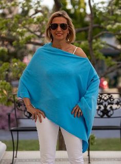 This On Trend Ocean Blue Ladies Pull On Poncho is a must have Knitted in a soft ocean blue color yarn Yarn content: 100% Acrylic Color: Ocean Blue Pull on body Can be worn a few different ways for a stylish modern clean look Casual One-size Poncho, Oversized Chic Blue Sweater, Chic Oversized Blue Sweater, One Size Blue Knit Sweater, Blue Summer Sweater For Beach, Chic Blue Soft Knit Top, Chic Blue Soft Knit Sweater, Blue Knitted Summer Sweater, Winter Blue Knit Poncho