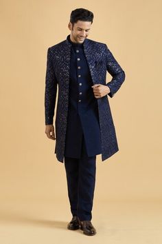 Navy blue sherwani featuring floral thread embroidery all over highlighted with sequin. Paired with a solid kurta and a pant. - Aza Fashions Traditional Drape Sherwani With Dori Work For Reception, Designer Bollywood Sherwani With Dori Work, Sherwani With Dori Work For Receptions And Festivals, Festive Sherwani With Dori Work For Reception, Blue Sherwani With Dori Work In Traditional Drape, Blue Sherwani With Dori Work, Dori Work Sherwani Straight Kurta For Wedding, Dori Work Sherwani For Wedding, Straight Kurta Style, Blue Sherwani With Dori Work For Festivals