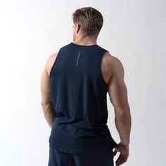 This Men's Performance Tank Top is designed to keep you comfortable without restricting your range of motion. It features moisture-wicking fabric to draw sweat away from the skin and quick-drying material to ensure you always feel dry. Ultra-soft and lightweight, this shirt is perfect for any outdoor or indoor training session. The Model is 5'11", 187lbs, wearing a size Large. Indoor Workout, Basic Shirts, Men's Tank, Muscle Tanks, Range Of Motion, Moisture Wicking Fabric, Black Tank Tops, Breathable Fabric, Moisture Wicking