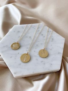 Part of our Golden botanicals collection, these stamped florals are perfect for Spring layering. These necklaces are our large size charms, which measure 5/8 inch across. Please select the charm you would like from the drop down, and let us know in the notes section whether you would like a 16, 18, or 20 inch chain. If no selection is made, default will be 18 inches. Options: Wildflowers Daffodil Poppy Each piece comes packaged in our signature kraft logo box ready for gifting. Gold Filled Care: Stamp Necklace, Spring Layering, Stamped Necklaces, Birth Month Flower, Month Flowers, Birth Month Flowers, Birth Month, Orlando Fl, Gold Filled Jewelry