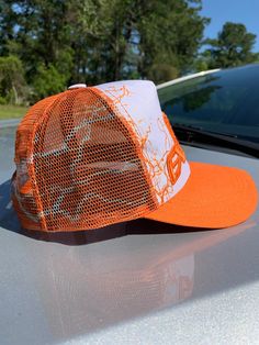 Material/ Special Features: The Graphic Trucker Hats is made of 100% Polyester and 100% Polyester Mesh Back. A Hustle Exclusive logo embroidered in front/back, with a plastic adjustable snap. Orange Trucker Snapback Hat, Adjustable Orange Cap, Orange Trucker Baseball Cap One Size, Orange Trucker Hat With Curved Brim, Orange Trucker Hat, One Size Fits Most, Orange Snapback Trucker Hat For Outdoor, Adjustable Orange Trucker Hat, Orange Adjustable Snapback Hat With Curved Brim, Orange Adjustable Snapback Hat