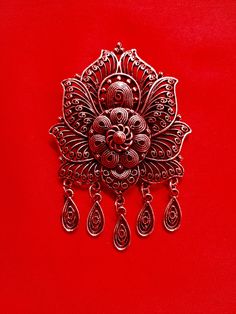 traditional cooper brooch that very beautiful with a lot of detail, it's appropriate to wear with kebaya, traditional clothes, baju kurung and batik we have another color: silver, you check in another listing, in product category: brooch& jewelry dimention: 5cmx 9cm Intricate Pendant Brooches For Weddings, Traditional Ceremonial Brooch Jewelry, Traditional Pendant Brooches For Formal Occasions, Traditional Formal Brooch With Intricate Design, Elegant Metal Brooches As Gift, Traditional Handmade Brooch For Formal Occasions, Handmade Traditional Brooch For Formal Occasions, Traditional Red Brooch For Gift, Traditional Red Brooches For Gifts