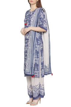 Blue overall print detailed kurta. Comes with white palazzo and dupatta. 
Components: 3
Neckline: Round 
Sleeve Length: Half 
Fabric: Muslin Slub
Color: Blue,White
Printed
Closure: Kurta: Front Buttoned Placket
Bordered Dupatta - Aza Fashions Blue Cotton Sets With Printed Border, Indigo Printed Cotton Sets, Blue Digital Print Straight Kurta Set, Cotton Kurta With Digital Print, Blue Printed Palazzo Set For Festive Occasions, Festive Printed Blue Palazzo Set, Festive Blue Printed Palazzo Set, Festive Blue Printed Dupatta, Bohemian Blue Sets With Digital Print