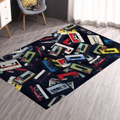 the rug is made up of cassettes and tape recorders