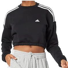 Product Description: Adidas Crop Crew Neck; Sweatshirt. Your Weekend Look Isnt Just About Comfort. Its Also About Casual-Cool Style. Pull On This Sporty Adidas Sweatshirt And Have It All. Whether Youre Kicking Back At Home Or Heading Out, The Loose Cut And Soft Fleece Ensure You Stay Cozy. Features: - Loose Fit. -Crewneck. -70% Cotton, 30% Recycled Polyester Fleece. - Cropped Length. -Elastic Cuffs And Hem. Adidas Relaxed Fit Tops With Ribbed Cuffs, Adidas Sporty Tops For Loungewear, Sporty Adidas Tops For Loungewear, Adidas Cropped Hoodie, Adidas Sweats, Adidas Three Stripes, Adidas Crop, Retro Streetwear, Adidas Originals Women