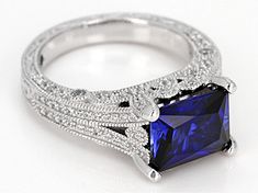 Vanna K ™ for Bella Luce ® lab created sapphire and white diamond simulant 4.81ctw baguette and round, Platineve® ring. Measures approximately 0.38"L x 0.13"W and is not sizeable. Each Vanna K™ design has a signature label that features a lab created sapphire. Gia Certified Square Cut Sapphire Ring, Elegant Gia Certified Square Cut Sapphire Ring, Elegant Lab-created Radiant Cut Sapphire Ring, Elegant Radiant Cut Lab-created Sapphire Ring, Elegant Rectangular Lab-created Sapphire Rings, Elegant Princess Cut Lab-created Sapphire Ring, Elegant Jewelry With Square Cut Lab-created Sapphire, Elegant Square Cut Lab-created Sapphire Jewelry, Rectangular Cushion