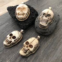 Unique and powerful double sided pendant, made with a skull made out of carved bone, and unique alloy metal designs around it and on its back. The back of the pendant has an embossed flower. The Pendant comes with a black leather cord, but you may choose to wear it with any chains that you already have as the bail is 1cm- 0.40 inch in diameter. The skull pendant itself is 5cm- 2 inch long 2.5cm- 1 inch wide A unique addition to your jewelry collection ⚡️GET 20% OFF by joining Akashi's VIP List ⚡ Unique Carved Bone Jewelry, Unique Bone-colored Carved Jewelry, Halloween Skull Jewelry In Bone Color, Halloween Skull Shaped Bone Jewelry, Skull-shaped Bone Jewelry For Gifts, Bone-colored Skull Jewelry For Gift, Skull Shaped Bone Colored Jewelry For Gifts, Bone Color Skull Jewelry For Gifts, White Skull Jewelry For Day Of The Dead