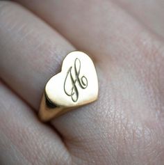 The heart signet ring is a classic, and this one is personalized with an inset monogram. This item is engravable with text or monogram of your choice at no extra cost. The initals are engraved onto the ring and embedded in the 3D model for a flawless embossed finish. You may choose to customize this ring with different images, letters or words. A render of your custom design will be sent to you before production. A gemstone on this ring is also possible, please inquire for pricing details and op Vintage Personalized 14k Gold Engraved Ring, Classic Jewelry For Valentine's Day, Elegant Signet Ring With Initials For Anniversary, Vintage Engraved Initial Ring For Anniversary, Formal Nameplate Jewelry With Initials, Personalized Engraved 14k Gold Ring, Classic 14k Gold Jewelry For Personalized Gift, Classic Monogram Nameplate Jewelry, Vintage Gold Initial Ring Personalized