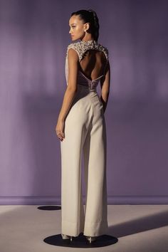 White full length jumpsuit with a ruched bodice and pearls embroidery on the yoke. - Aza Fashions Sleeveless Jumpsuits And Rompers For Wedding Guest, Elegant Sleeveless Jumpsuits And Rompers For Banquet, Fitted Sleeveless Embellished Jumpsuits And Rompers, Embellished Fitted Sleeveless Jumpsuits And Rompers, Embellished Sleeveless Fitted Jumpsuit, Elegant Embellished Sleeveless Jumpsuits And Rompers, Fitted Sleeveless Jumpsuits For Banquet, Elegant Sleeveless Jumpsuits And Rompers For Wedding, Elegant Sleeveless Jumpsuit For Wedding