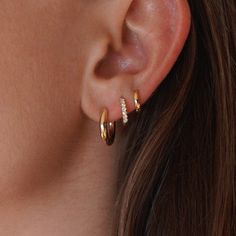 14k single solid gold hoop with faceted back. This earring is made to delicately remind you of your goddess power. Pictured on model in third piercing. These are the smaller version of our Solid Goddess Hoops. Gold-plated Yellow Gold Cartilage Earrings, Yellow Gold Pierced Cartilage Earrings, 14k Gold Tarnish Resistant Piercings, Everyday Rose Gold Cartilage Earrings, Minimalist 14k Gold Hoop Piercings, Single Gold-plated Cartilage Earring, Rose Gold 14k Gold Filled Hoop Earrings, Yellow Gold Huggie Cartilage Earrings, 14k Gold Small Hoop Cartilage Earring