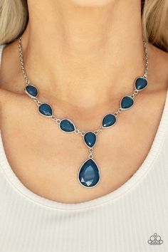 Encased in sleek silver fittings, a chain of faceted blue teardrops gives way to an oversized blue teardrop pendant for an enchanting pop of color below the collar. Features an adjustable clasp closure.

Sold as one individual necklace. Includes one pair of matching earrings. Paparazzi Jewelry Images, Paparazzi Accessories Jewelry, Paparazzi Accessories, Teardrop Pendant, Chic Jewelry, Blue Necklace, Paparazzi Jewelry, Short Necklace, Drop Necklace