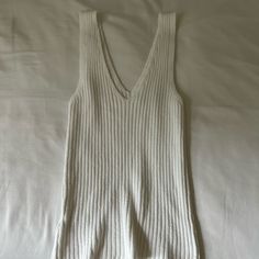 Brandy Melville Knit Top Never Worn, Excellent Condition No Tags Perfect For The Summer V-neck Pointelle Knit Tops For Loungewear, Knitted Cotton V-neck Top, Pointelle Knit V-neck Top For Day Out, Fitted Knitted Tops For Loungewear, Cozy Fitted Tops For Day Out, Cozy Fitted Top For Day Out, Cotton V-neck Sweater For Day Out, White Textured Knit V-neck Sweater Vest, White Ribbed Knit Sweater Vest